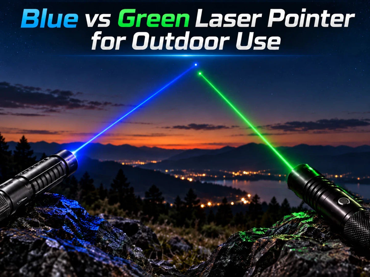 Blue and green laser pointer beams over a mountain landscape at dusk